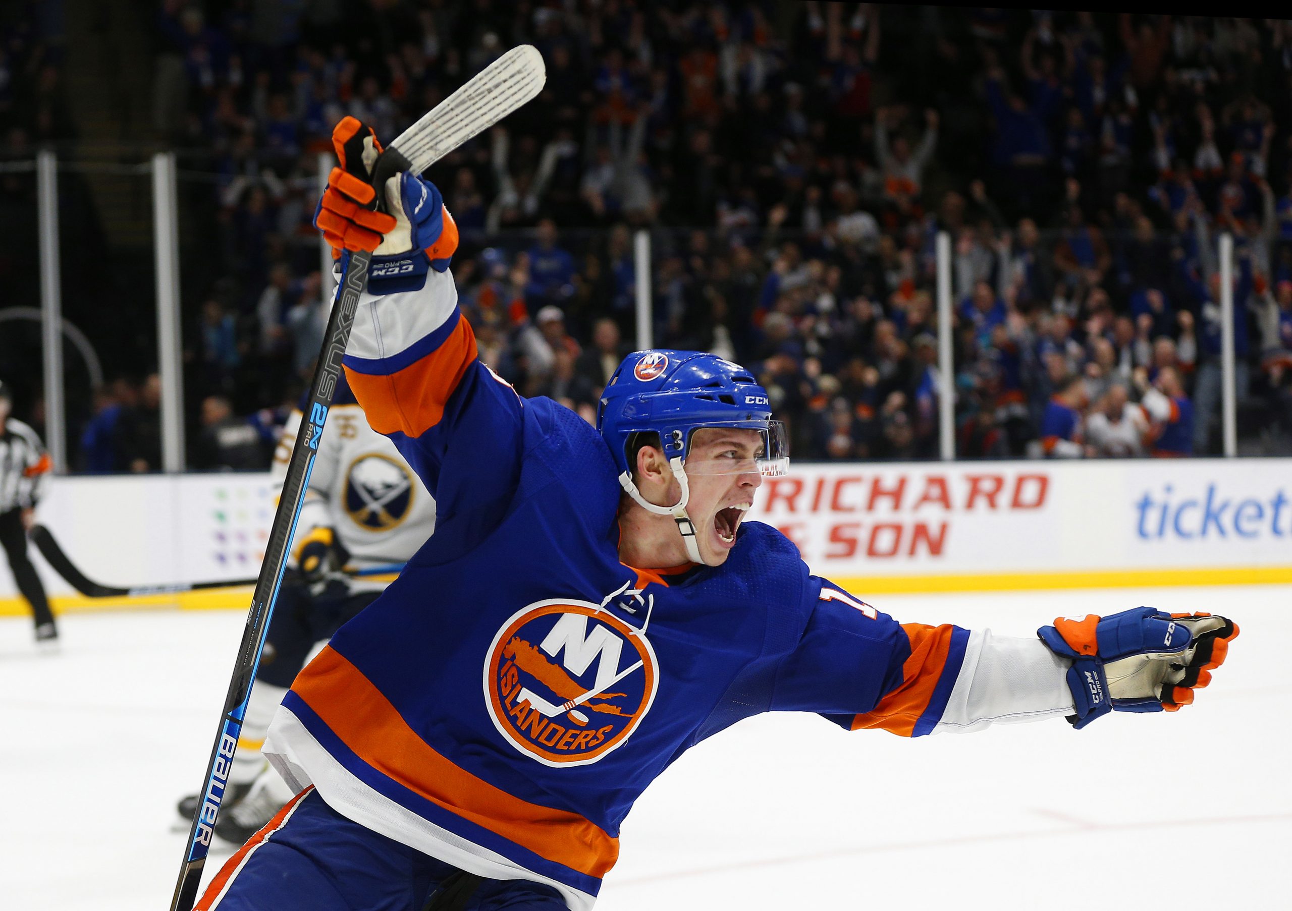 Dec 14, 2019; Uniondale, NY, USA; New York Islanders left wing Anthony Beauvillier (18) celebrates after scoring the game winning goal against the Buffalo Sabres during overtime at Nassau Veterans Memorial Coliseum. Mandatory Credit: Andy Marlin-USA TODAY Sports