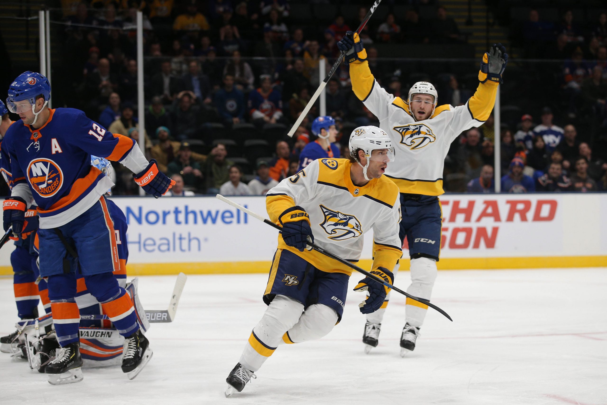 Dec 17, 2019; Uniondale, NY, USA; Nashville Predators center Craig Smith (15) celebrates his goal against the New York Islanders with center Colton Sissons (10) during the first period at Nassau Veterans Memorial Coliseum. Mandatory Credit: Brad Penner-USA TODAY Sports