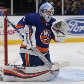 Dec 17, 2019; Uniondale, NY, USA; New York Islanders goalie Thomas Greiss (1) plays the puck against the Nashville Predators during the first period at Nassau Veterans Memorial Coliseum. Mandatory Credit: Brad Penner-USA TODAY Sports