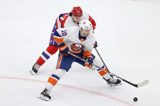Feb 10, 2020; Washington, District of Columbia, USA; New York Islanders center Derick Brassard (10) skates with the puck as Washington Capitals right wing T.J. Oshie (77) defends in the third period at Capital One Arena. Mandatory Credit: Geoff Burke-USA TODAY Sports