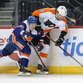 Feb 11, 2020; Brooklyn, New York, USA; New York Islanders center Casey Cizikas (53) checks Philadelphia Flyers defenseman Ivan Provorov (9) during the first period at Barclays Center. Cizikas would leave the game after the play. Mandatory Credit: Brad Penner-USA TODAY Sports