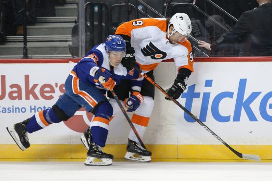 Feb 11, 2020; Brooklyn, New York, USA; New York Islanders center Casey Cizikas (53) checks Philadelphia Flyers defenseman Ivan Provorov (9) during the first period at Barclays Center. Cizikas would leave the game after the play. Mandatory Credit: Brad Penner-USA TODAY Sports