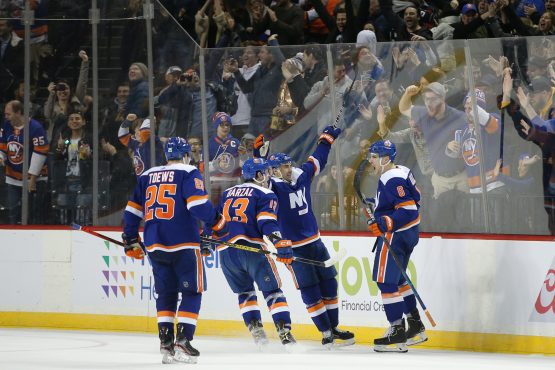 Feb 11, 2020; Brooklyn, New York, USA; New York Islanders defenseman Ryan Pulock (6) celebrates his game winning goal against the Philadelphia Flyers with teammates during the third period at Barclays Center. Mandatory Credit: Brad Penner-USA TODAY Sports