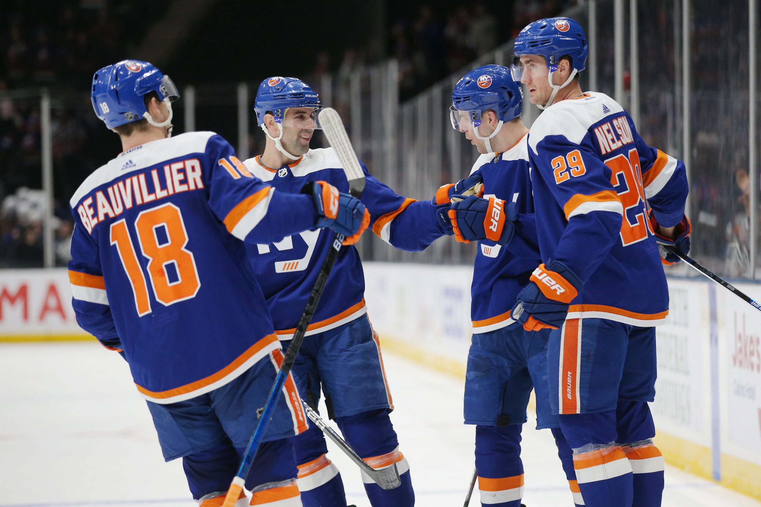 Feb 23, 2020; Uniondale, New York, USA; New York Islanders defenseman Devon Toews (25) celebrates his goal against the San Jose Sharks with teammates during the second period at Nassau Veterans Memorial Coliseum. Mandatory Credit: Brad Penner-USA TODAY Sports