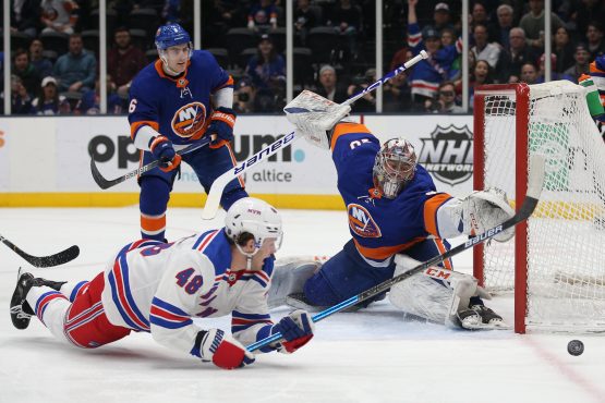 Feb 25, 2020; Uniondale, New York, USA; New York Islanders goalie Semyon Varlamov (40) makes a save on a shot by New York Rangers left wing Brendan Lemieux (48) during the first period at Barclays Center. Mandatory Credit: Brad Penner-USA TODAY Sports