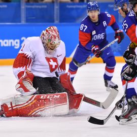 Olympics: Ice Hockey-Men Team Group A - KOR-SUI