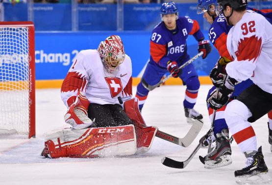Olympics: Ice Hockey-Men Team Group A - KOR-SUI