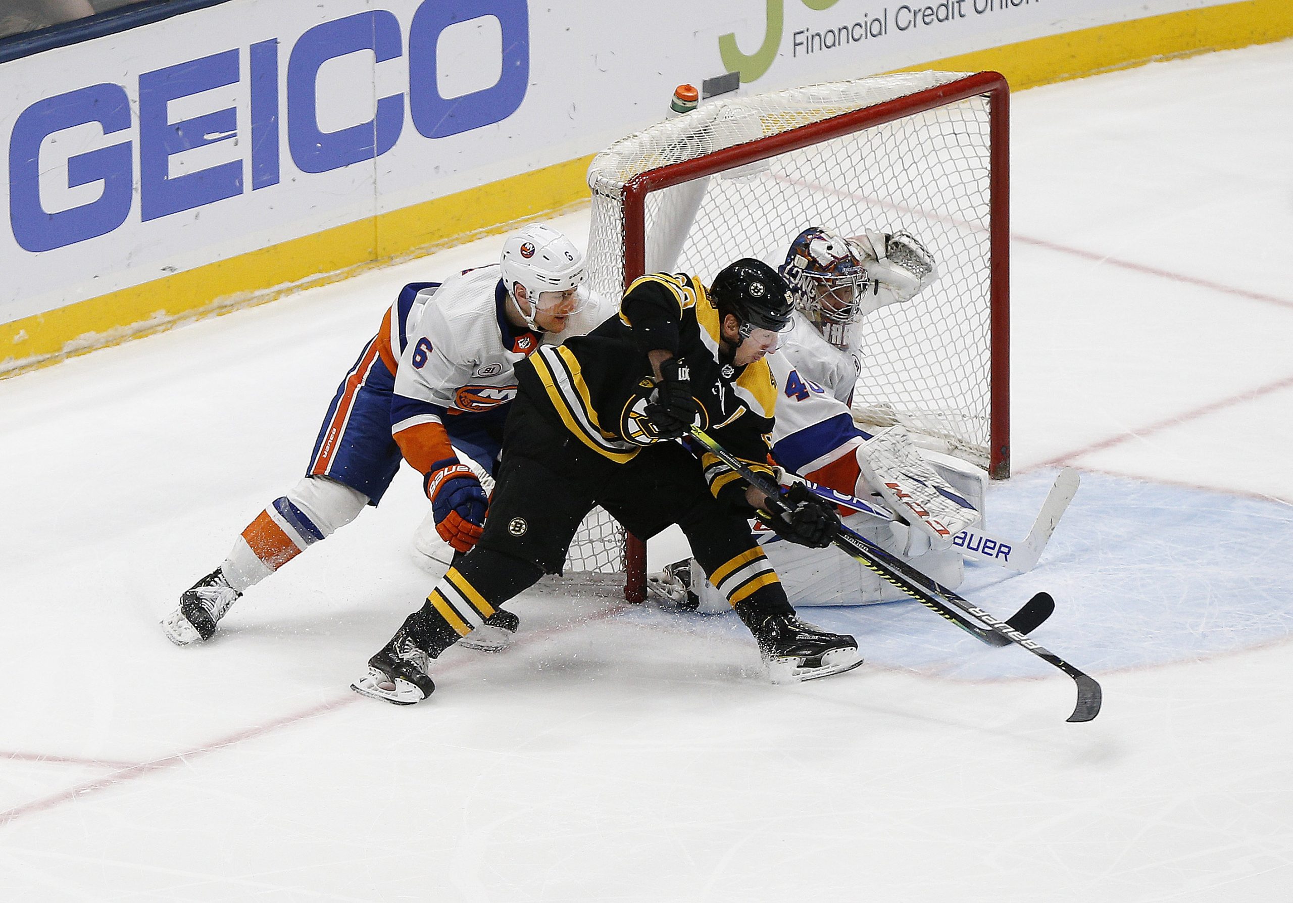 Feb 29, 2020; Uniondale, New York, USA; Boston Bruins left wing Brad Marchand (63) scores a goal against New York Islanders goaltender Semyon Varlamov (40) during the third period at Nassau Veterans Memorial Coliseum. Mandatory Credit: Andy Marlin-USA TODAY Sports