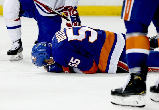 Mar 3, 2020; Brooklyn, New York, USA; New York Islanders defenseman Johnny Boychuk (55) lays on the ice after being injured against the Montreal Canadiens during the third period at Barclays Center. Mandatory Credit: Andy Marlin-USA TODAY Sports