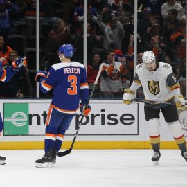 Dec 5, 2019; Uniondale, NY, USA; New York Islanders center Brock Nelson (29) celebrates with defenseman Adam Pelech (3) after scoring a goal against the Vegas Golden Knights in front of Golden Knights defenseman Nicolas Hague (14) during the third period at Nassau Veterans Memorial Coliseum. Mandatory Credit: Brad Penner-USA TODAY Sports