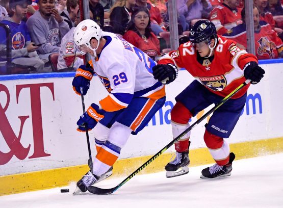 Dec 12, 2019; Sunrise, FL, USA; New York Islanders center Brock Nelson (29) controls the puck from Florida Panthers defenseman MacKenzie Weegar (52) during the first period at BB&T Center. Mandatory Credit: Steve Mitchell-USA TODAY Sports