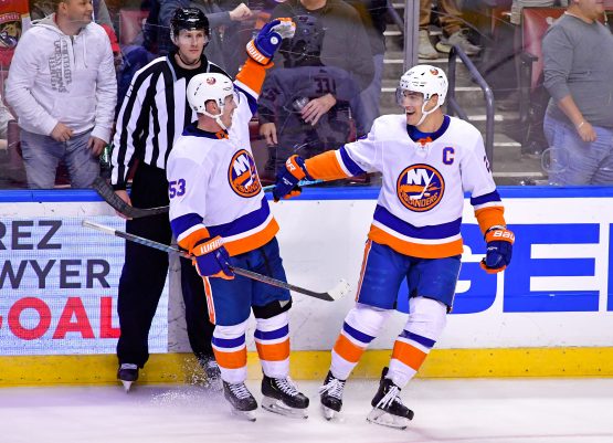 Dec 12, 2019; Sunrise, FL, USA; New York Islanders center Casey Cizikas (left) reacts after teammate left wing Anders Lee (right) scored an empty net gaol during the third period against the Florida Panthers at BB&T Center. Mandatory Credit: Steve Mitchell-USA TODAY Sports