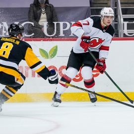 new-jersey-devils-center-yegor-sharangovich-passes-the-puck-while-picture-id1232457452