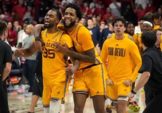 Arizona State San Devils basketball team celebrate together.