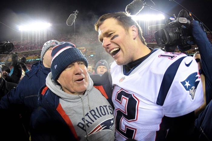 Bill Belichick and Tom Brady of the New England Patriots embrace after winning the AFC Championship.