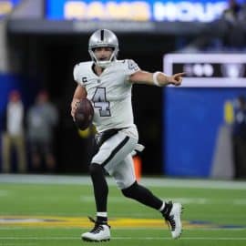 Derek Carr of The Raiders plays against the Rams.