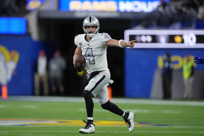 Derek Carr of The Raiders plays against the Rams.