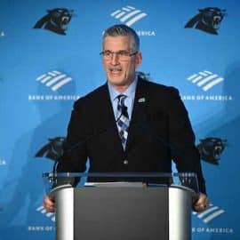 Frank Reich stands out the podium in Carolina.