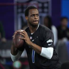 Geno Smith holds a ball at the Pro Bowl.