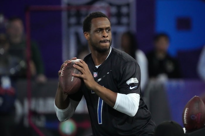 Geno Smith holds a ball at the Pro Bowl.