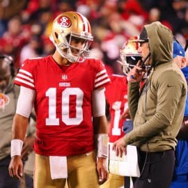 Jimmy Garoppolo speaks with Kyle Shanahan on the sideline.