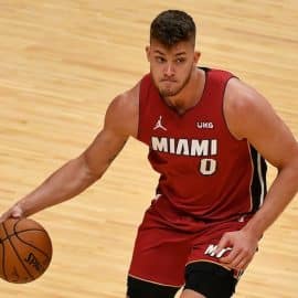 Miami Heat center Meyers Leonard dribbling the ball.