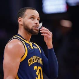 Stephen Curry of the Golden State Warriors chews on his mouthpiece.