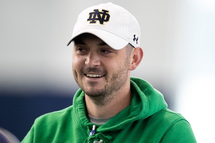 Tommy Rees smiles with a Notre Dame hat on.