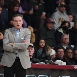 Iona University head coach Rick Pitino stands and looks.