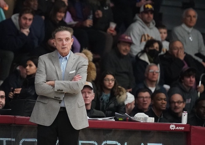 Iona University head coach Rick Pitino stands and looks.