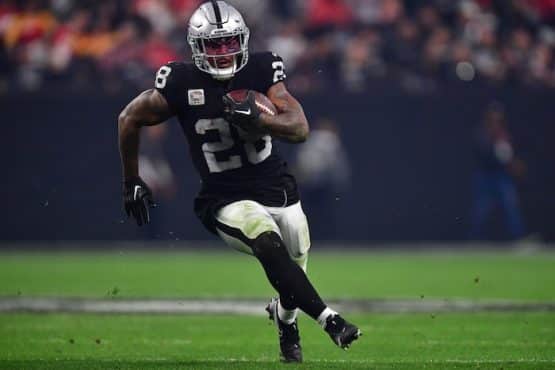 Las Vegas Raiders running back Josh Jacobs runs the ball.