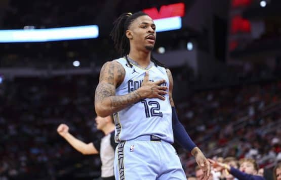 Memphis Grizzlies guard Ja Morant pounds chest.