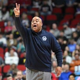 Penn State Nittany Lions head coach Micah Shrewsberry holds up a 2-sign.