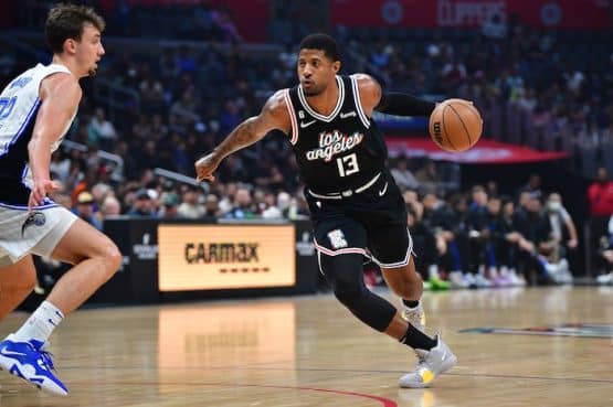 Los Angeles Clippers forward Paul George dribbles the ball.