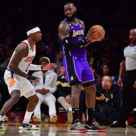 Los Angeles Lakers forward LeBron James holds the ball.