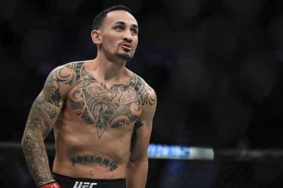 Max Holloway stands in the octagon.