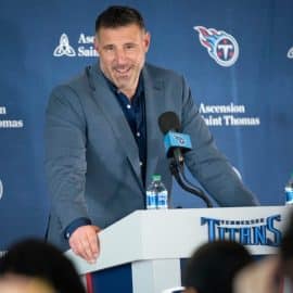 Tennessee Titans head coach Mike Vrabel at a podium.