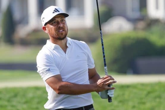 Xander Schauffele swings the club.