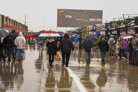 NASCAR fans walk in rain before charlotte 600 at charlotte (1)