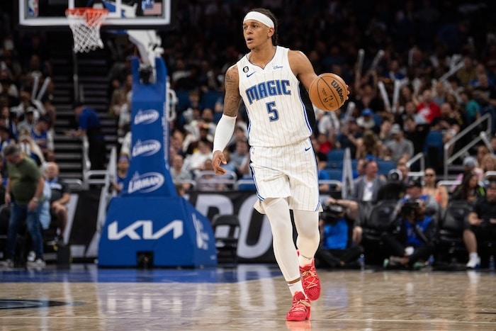 Orlando Magic forward Paolo Banchero dribbles the ball.