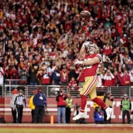San Francisco 49ers running back Christian McCaffrey tosses the ball.