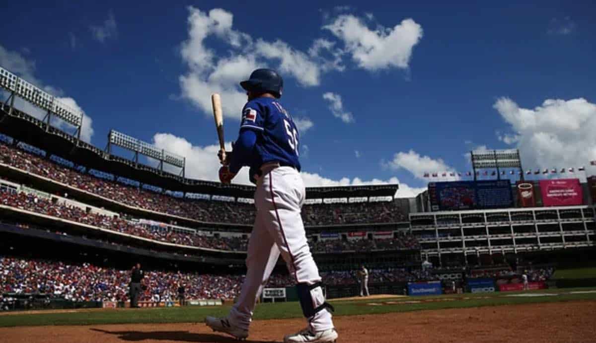 Rapper and Singer Bad Bunny walks in the outfield during the MLB