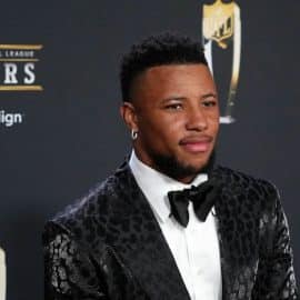Saquon Barkley poses for a photo on the red carpet