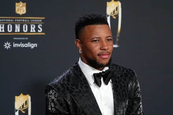 Saquon Barkley poses for a photo on the red carpet