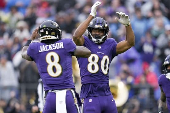 Baltimore Ravens tight end Isaiah Likely (80) celebrates a touchdown with quarterback Lamar Jackson (8)