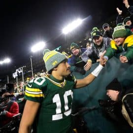 Green Bay Packers quarterback Jordan Love (10) celebrates with fans