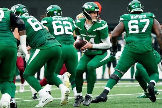 New York Jets quarterback Trevor Siemian (14) is shown before handing the ball to a teammate