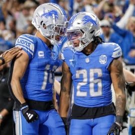 Detroit Lions running back Jahmyr Gibbs (26) celebrates a touchdown against Tampa Bay Buccaneers with wide receiver Amon-Ra St. Brown (14)