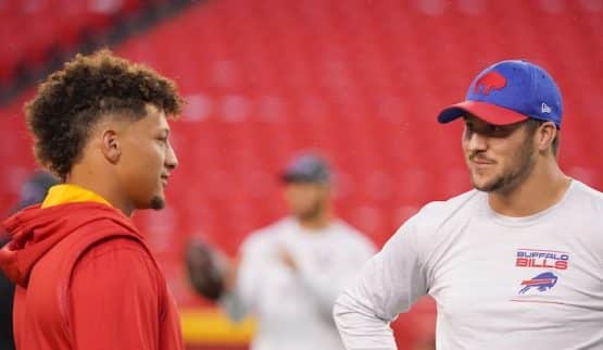 Kansas City Chiefs quarterback Patrick Mahomes (15) talks with Buffalo Bills quarterback Josh Allen (17)