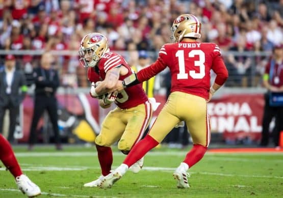 San Francisco 49ers quarterback Brock Purdy (13) hands off the ball to running back Christian McCaffrey (23)